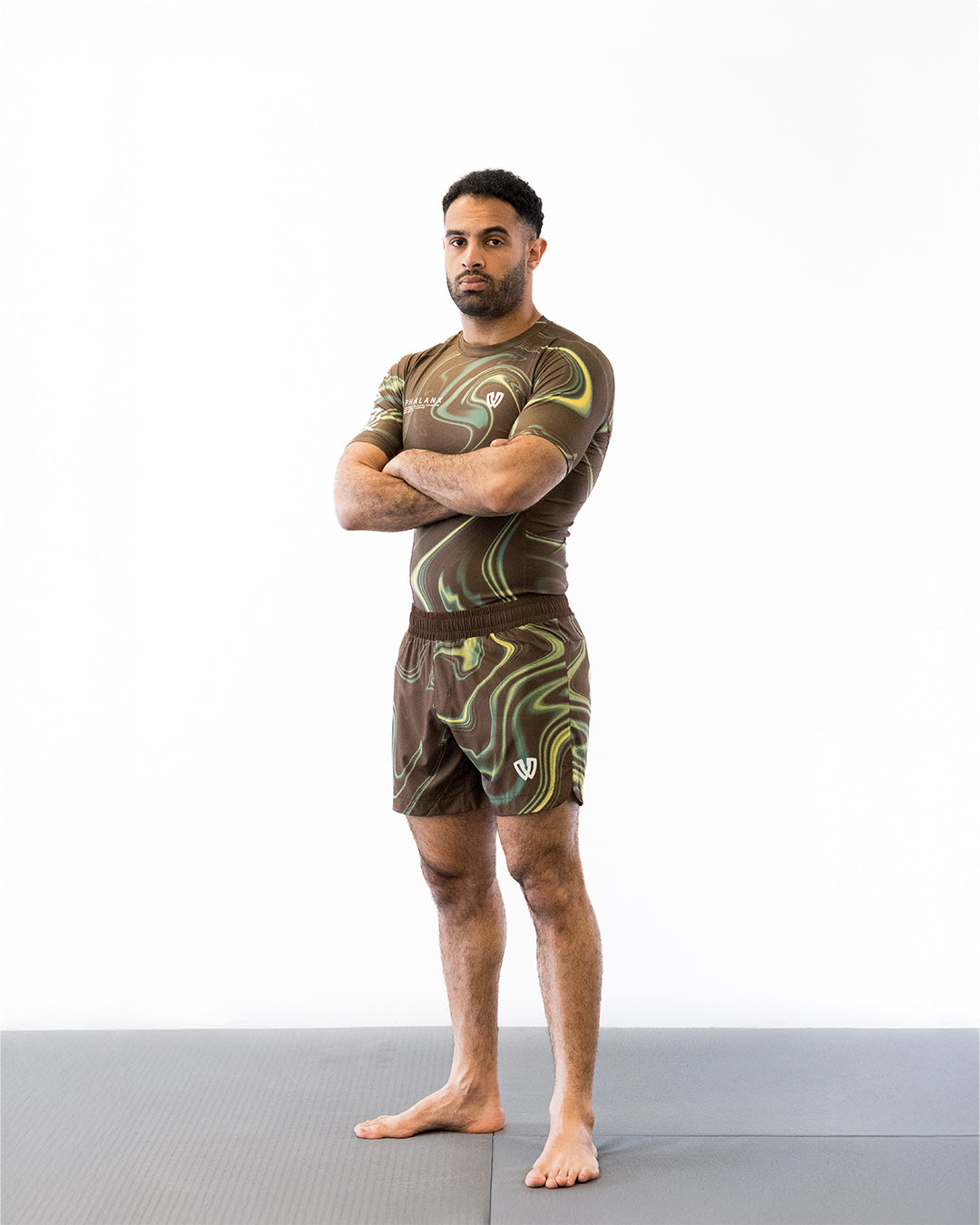 Brown and green no-gi jiu jitsu rash guard and shorts kit