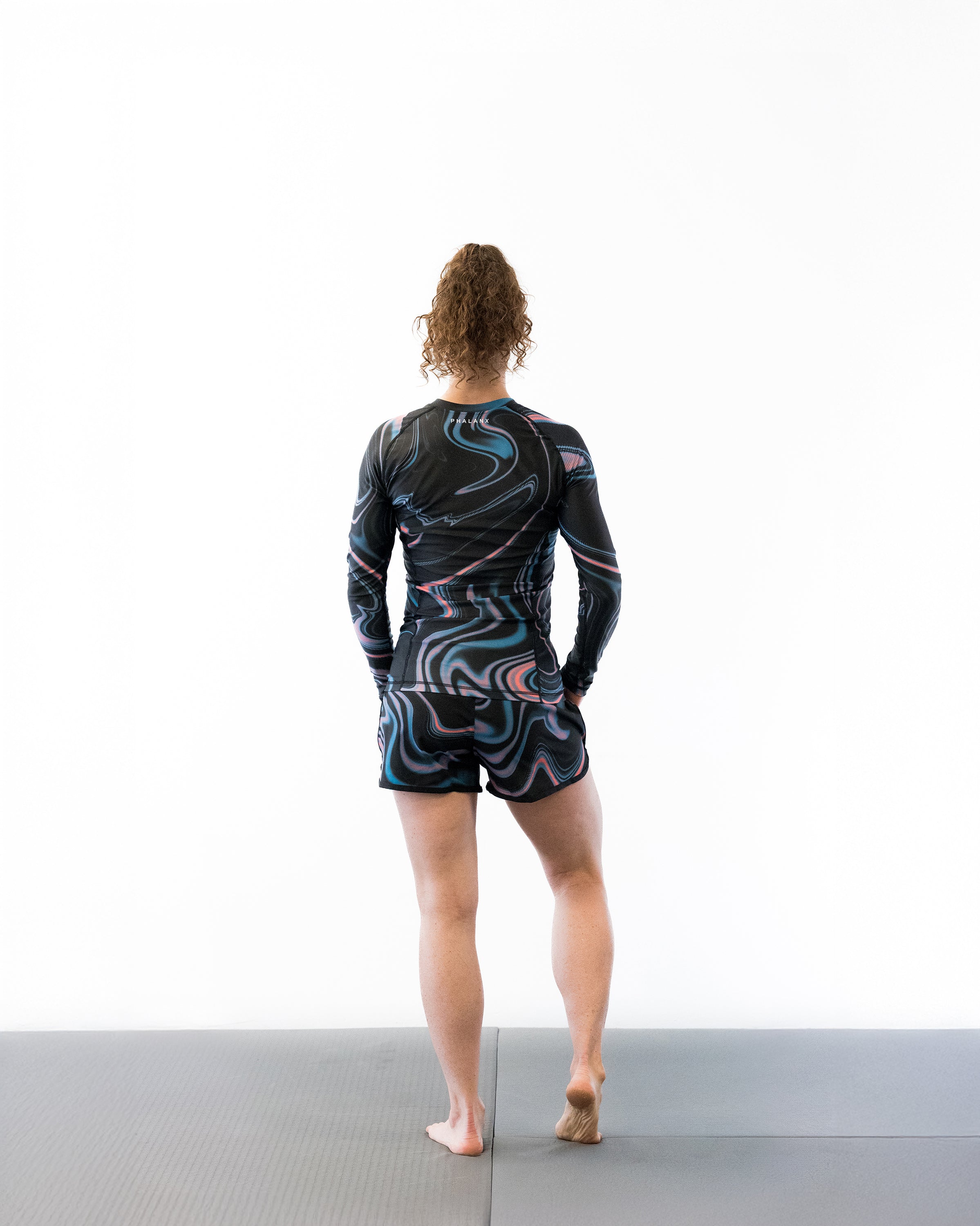 Black with swirls women's jiu jitsu rash guard
