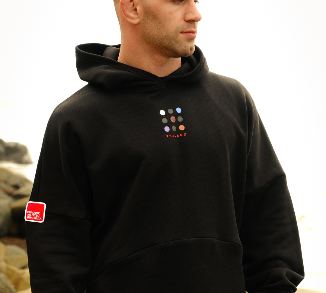 Phalanx Jiu Jitsu premium black oversized hoodie with ranked print, fully enclosed front pocket & patchwork. Made from uniquely sourced premium French terry fabric. High-level Brazilian Jiu-jitsu athletic apparel, the best brand in No Gi.
