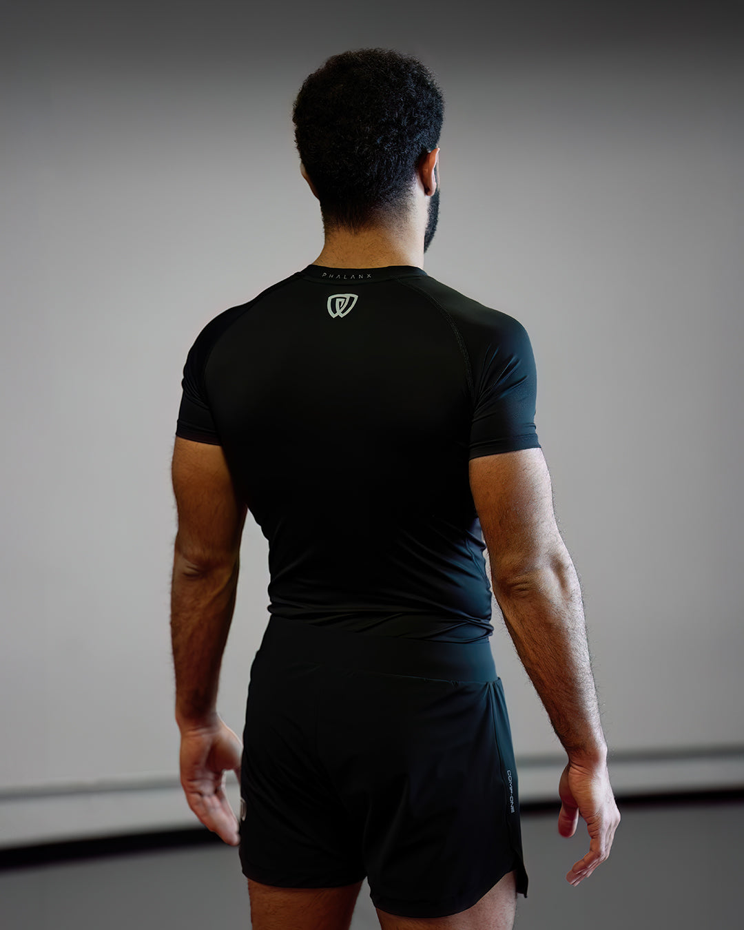 Phalanx jiu jitsu rash guard for BJJ and MMA, compression top short sleeve rashguard perfect for No Gi Jiu Jitsu, Brazilian Jiu-Jitsu and Mixed Martial Arts - all grappling and wrestling Spartan Race, Tough Mudder, Surfing, Yoga - all athletics! Workout clothes for a wide range of everyday sports, gym wear and exercise activities.