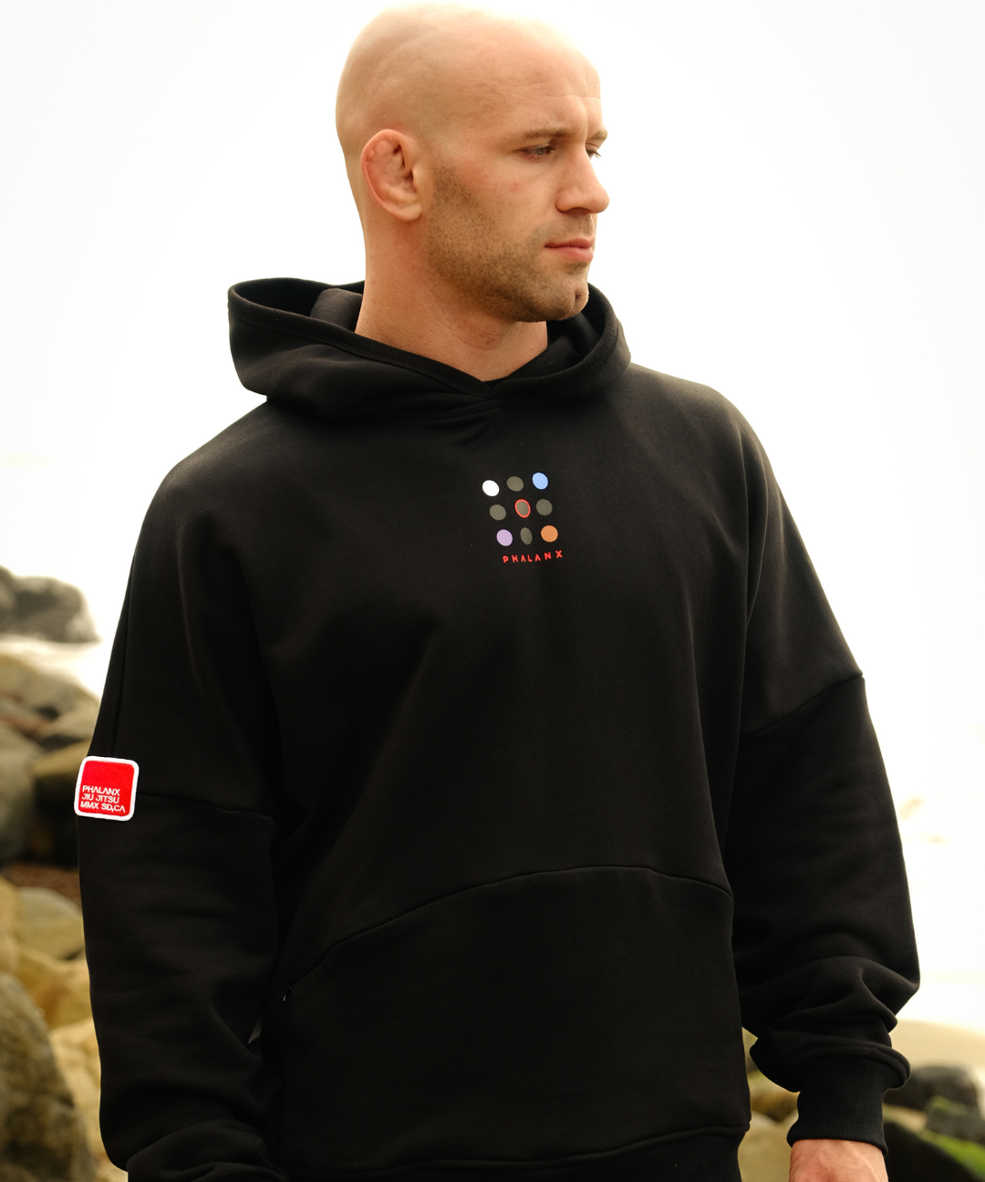 Phalanx Jiu Jitsu premium black oversized hoodie with ranked print, fully enclosed front pocket & patchwork. Made from uniquely sourced premium French terry fabric. High-level Brazilian Jiu-jitsu athletic apparel, the best brand in No Gi.